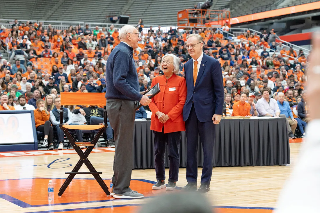 Jim Boeheim talking with Chancellor Kent Syverud and Dr. Ruth Chen.