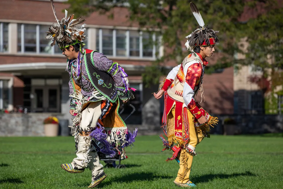 Indigenous dancers celebrating together.